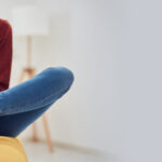 Woman,With,Feet,Intense,Pain,Sitting,On,A,Couch,At