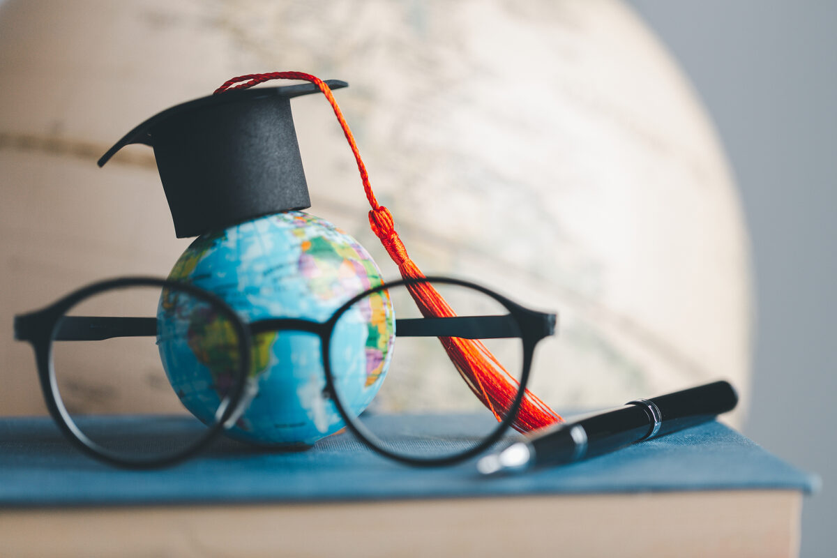 Graduation Cap With Earth Globe. Concept Of Global Business Stud