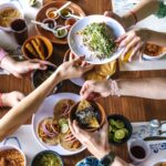 Group,Of,Friend,Eating,Mexican,Tacos,And,Traditional,Food,,Snacks